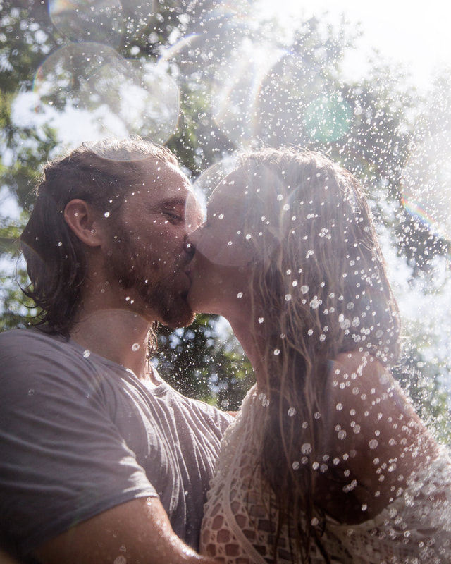 Engagement Photo of Young Couple in the Rain