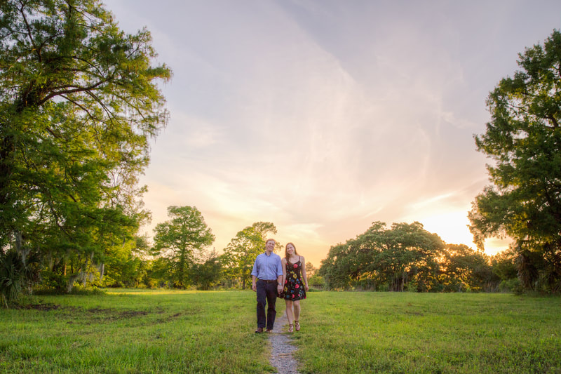 Engagement Photo in a Field at Sunset
