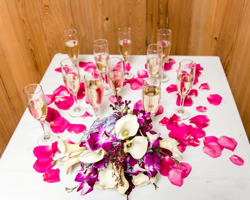 Champagne Table with Rose Petals and a Bouquet