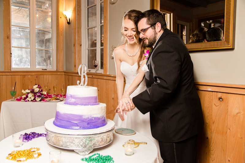 Bride and Groom Cutting their Cake